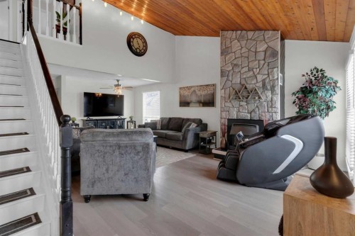 415 Bruce Avenue, Carbon, AB - Indoor With Fireplace