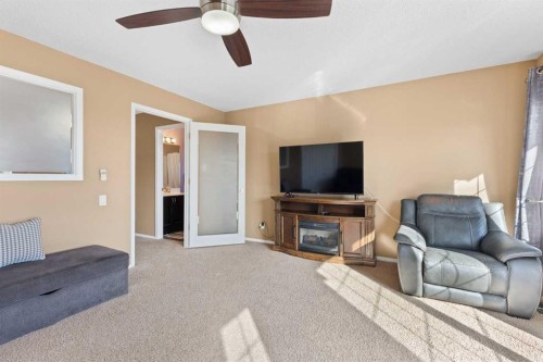 227 Bridlewood Circle Sw, Calgary, AB - Indoor Photo Showing Living Room