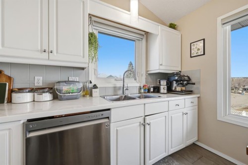 10205 Hidden Valley Drive Nw, Calgary, AB - Indoor Photo Showing Kitchen With Double Sink