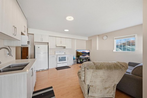 10205 Hidden Valley Drive Nw, Calgary, AB - Indoor Photo Showing Kitchen With Double Sink