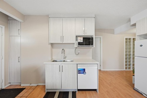 10205 Hidden Valley Drive Nw, Calgary, AB - Indoor Photo Showing Kitchen With Double Sink