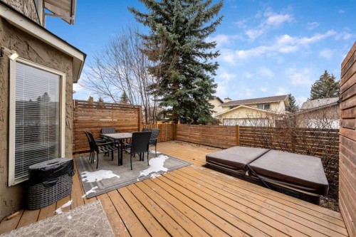 100 Woodfield Green Sw, Calgary, AB - Outdoor With Deck Patio Veranda With Exterior