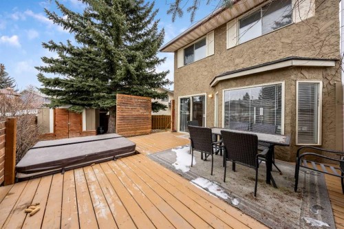 100 Woodfield Green Sw, Calgary, AB - Outdoor With Deck Patio Veranda With Exterior