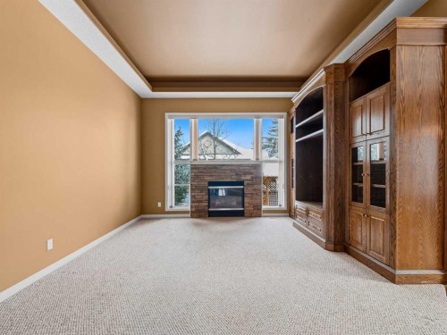 157 Valley Creek Place Nw, Calgary, AB - Indoor With Fireplace