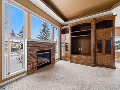 157 Valley Creek Place Nw, Calgary, AB - Indoor Photo Showing Other Room With Fireplace