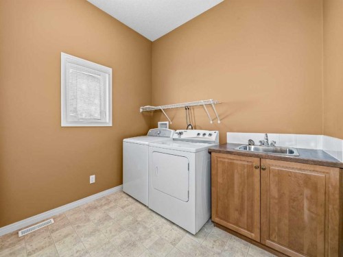 157 Valley Creek Place Nw, Calgary, AB - Indoor Photo Showing Laundry Room