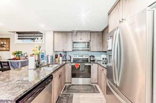 75 Howse Rise Ne, Calgary, AB - Indoor Photo Showing Kitchen With Double Sink With Upgraded Kitchen