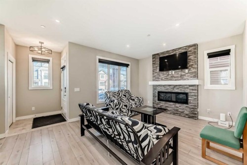 75 Howse Rise Ne, Calgary, AB - Indoor Photo Showing Living Room With Fireplace