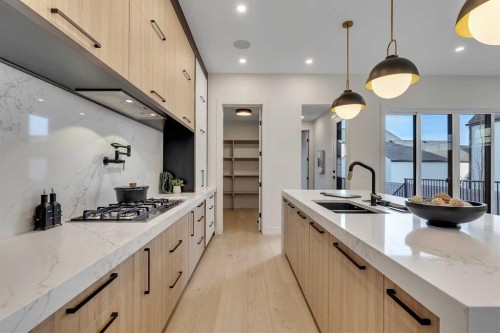 342 Normandy Drive Sw, Calgary, AB - Indoor Photo Showing Kitchen With Double Sink With Upgraded Kitchen