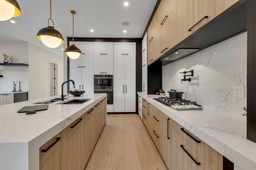 342 Normandy Drive Sw, Calgary, AB - Indoor Photo Showing Kitchen With Double Sink With Upgraded Kitchen