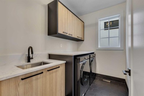 342 Normandy Drive Sw, Calgary, AB - Indoor Photo Showing Laundry Room