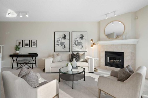 100 Hamptons Link Nw, Calgary, AB - Indoor Photo Showing Living Room With Fireplace