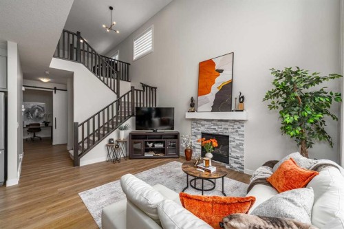 122 Ambleside Heath Nw, Calgary, AB - Indoor Photo Showing Living Room With Fireplace
