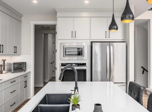 122 Ambleside Heath Nw, Calgary, AB - Indoor Photo Showing Kitchen With Upgraded Kitchen