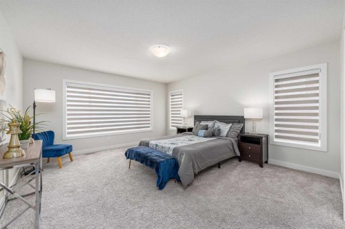 122 Ambleside Heath Nw, Calgary, AB - Indoor Photo Showing Bedroom