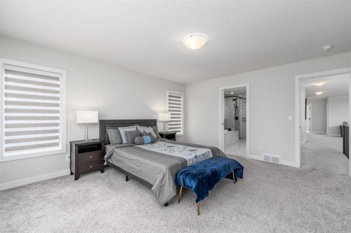 122 Ambleside Heath Nw, Calgary, AB - Indoor Photo Showing Bedroom