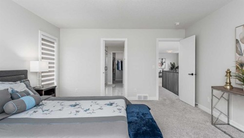 122 Ambleside Heath Nw, Calgary, AB - Indoor Photo Showing Bedroom