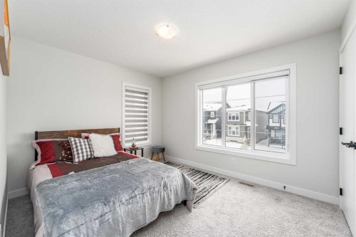 122 Ambleside Heath Nw, Calgary, AB - Indoor Photo Showing Bedroom