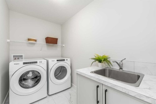 122 Ambleside Heath Nw, Calgary, AB - Indoor Photo Showing Laundry Room