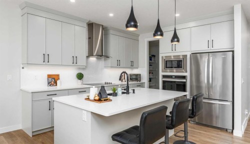 122 Ambleside Heath Nw, Calgary, AB - Indoor Photo Showing Kitchen With Upgraded Kitchen