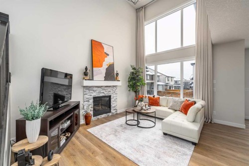 122 Ambleside Heath Nw, Calgary, AB - Indoor Photo Showing Living Room With Fireplace