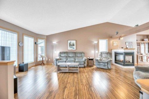 141 West Creek Crescent, Chestermere, AB - Indoor Photo Showing Living Room With Fireplace