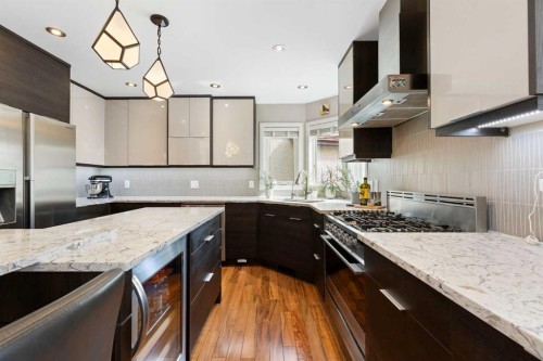 106 Shawnee Place Sw, Calgary, AB - Indoor Photo Showing Kitchen With Double Sink With Upgraded Kitchen