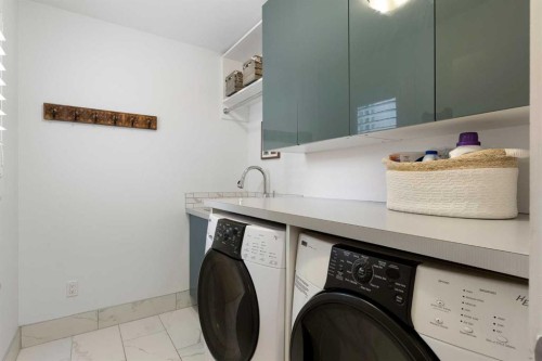 106 Shawnee Place Sw, Calgary, AB - Indoor Photo Showing Laundry Room