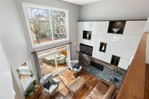 106 Shawnee Place Sw, Calgary, AB - Indoor Photo Showing Other Room With Fireplace