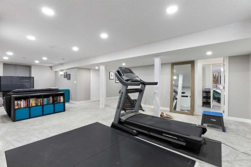 106 Shawnee Place Sw, Calgary, AB - Indoor Photo Showing Gym Room