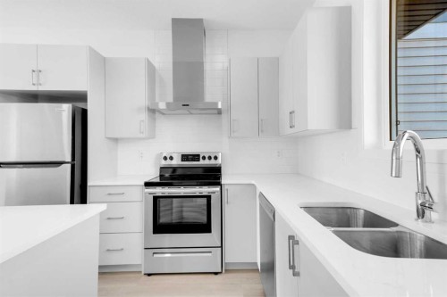 733 South Point Gate Sw, Airdrie, AB - Indoor Photo Showing Kitchen With Stainless Steel Kitchen With Double Sink