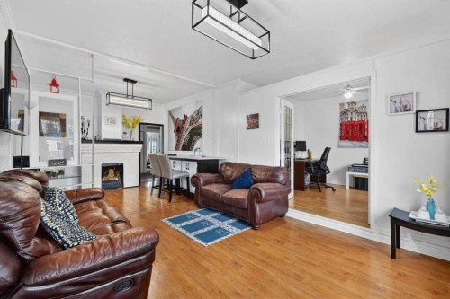 2130 20 Avenue, Bowden, AB - Indoor Photo Showing Living Room With Fireplace