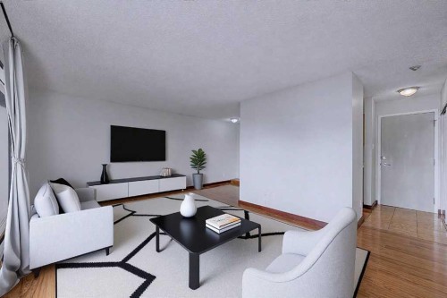 105-659 4 Avenue Ne, Calgary, AB - Indoor Photo Showing Living Room