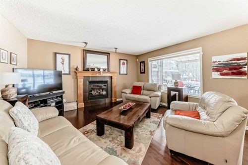 41 Kincora Drive Nw, Calgary, AB - Indoor Photo Showing Living Room With Fireplace
