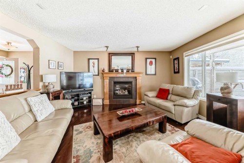 41 Kincora Drive Nw, Calgary, AB - Indoor Photo Showing Living Room With Fireplace