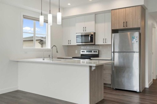 122 Spring Creek Common Sw, Calgary, AB - Indoor Photo Showing Kitchen With Upgraded Kitchen
