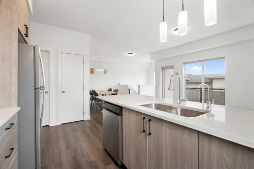 122 Spring Creek Common Sw, Calgary, AB - Indoor Photo Showing Kitchen With Double Sink With Upgraded Kitchen