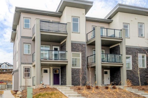 122 Spring Creek Common Sw, Calgary, AB - Outdoor With Balcony With Facade