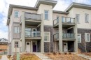 122 Spring Creek Common Sw, Calgary, AB  - Outdoor With Balcony With Facade 
