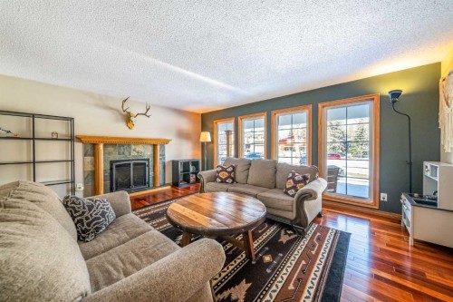 147 Midvalley Place Se, Calgary, AB - Indoor Photo Showing Living Room With Fireplace