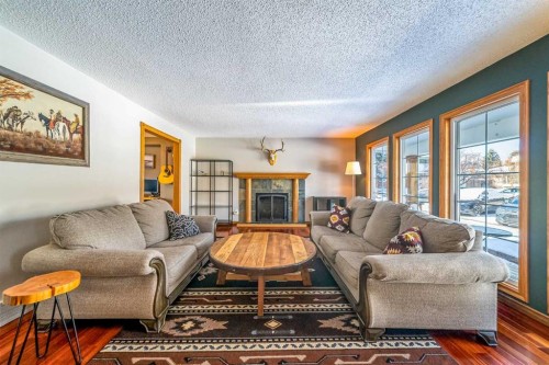 147 Midvalley Place Se, Calgary, AB - Indoor Photo Showing Living Room With Fireplace