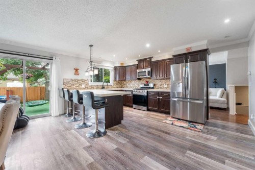 80 Taylor Way Se, Airdrie, AB - Indoor Photo Showing Kitchen With Stainless Steel Kitchen With Upgraded Kitchen