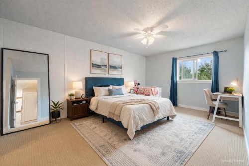 80 Taylor Way Se, Airdrie, AB - Indoor Photo Showing Bedroom