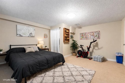 80 Taylor Way Se, Airdrie, AB - Indoor Photo Showing Bedroom