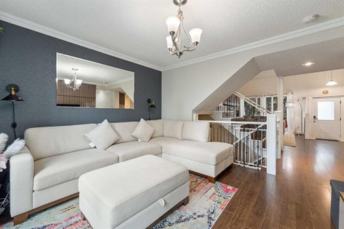 80 Taylor Way Se, Airdrie, AB - Indoor Photo Showing Living Room