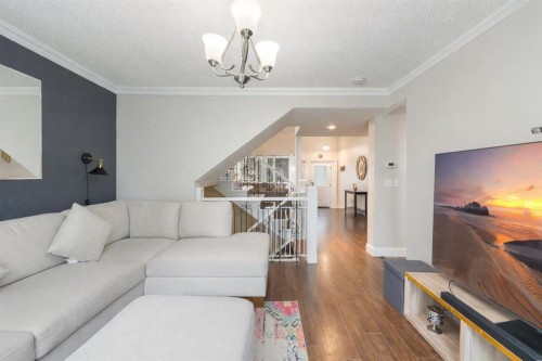 80 Taylor Way Se, Airdrie, AB - Indoor Photo Showing Living Room