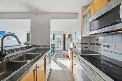 49 Royal Birch Mount Nw, Calgary, AB - Indoor Photo Showing Kitchen With Double Sink