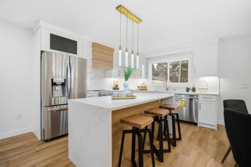 9407 Allison Drive Se, Calgary, AB - Indoor Photo Showing Kitchen With Stainless Steel Kitchen With Upgraded Kitchen