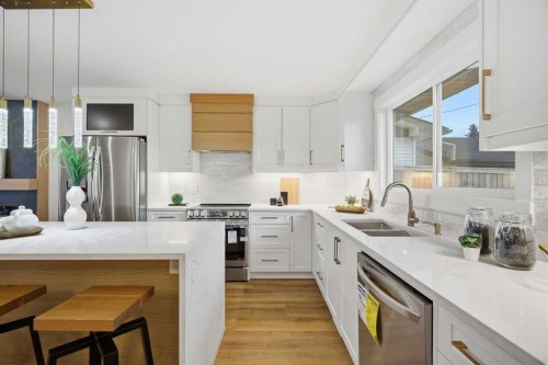9407 Allison Drive Se, Calgary, AB - Indoor Photo Showing Kitchen With Stainless Steel Kitchen With Double Sink With Upgraded Kitchen