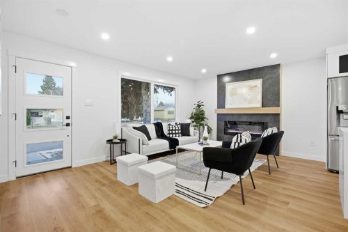 9407 Allison Drive Se, Calgary, AB - Indoor Photo Showing Living Room With Fireplace